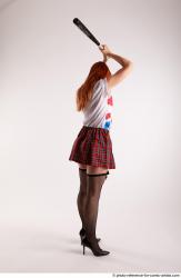 TINA STANDING POSE WITH BASEBALL BAT